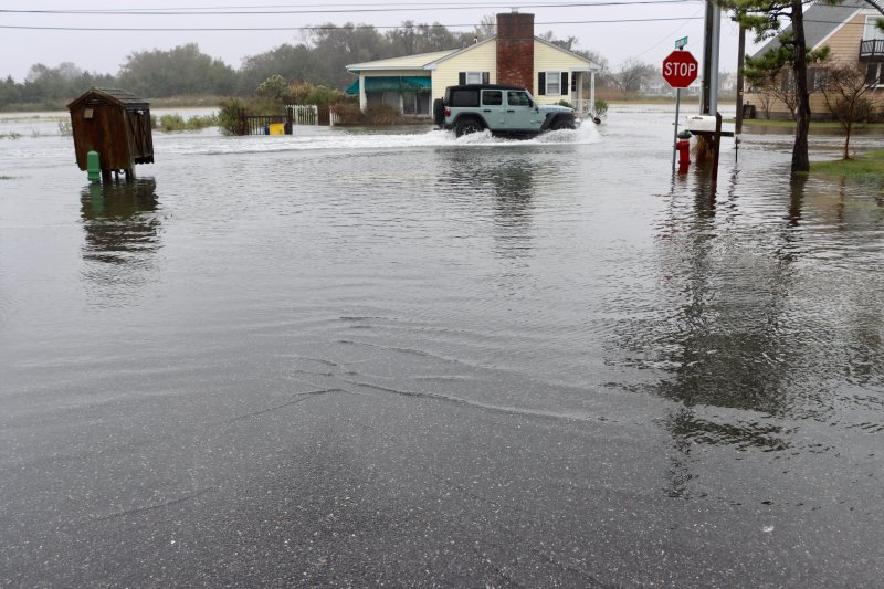 A no-wake zone was needed at Cedar Street and California Avenue in Lewes at high tide Oct. 13. BILL SHULL PHOTO